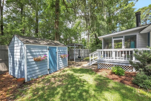 13 Bryan Wood Cir, Savannah, GA 31410 - view of yard featuring a shed, a sunroom, and a wooden deck