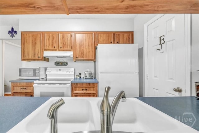 13 Bryan Wood Cir, Savannah, GA 31410 - kitchen featuring white appliances, under cabinet range hood, and brown cabinets