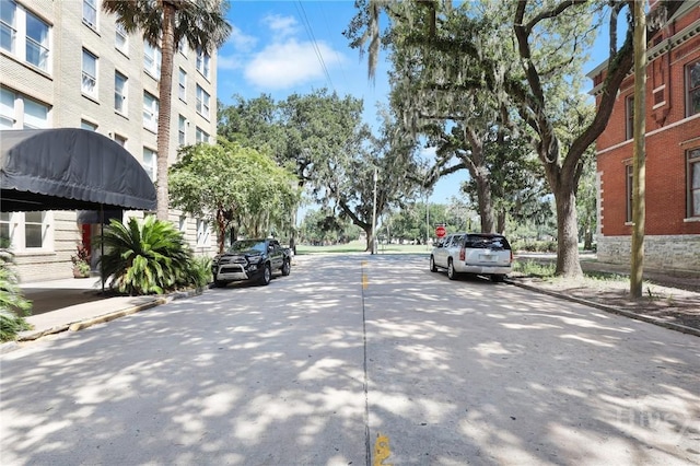 106 W Gwinnett St Unit 4D, Savannah, GA 31401 - view of concrete street featuring curbs, sidewalks, and traffic signs