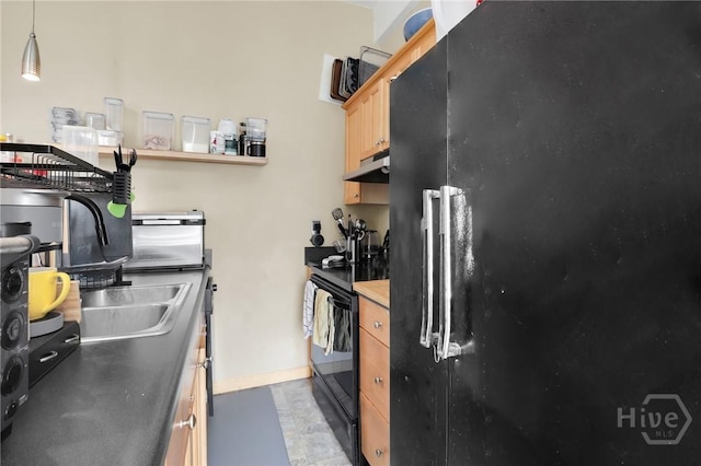 106 W Gwinnett St Unit 4D, Savannah, GA 31401 - kitchen with black appliances, under cabinet range hood, and light brown cabinetry