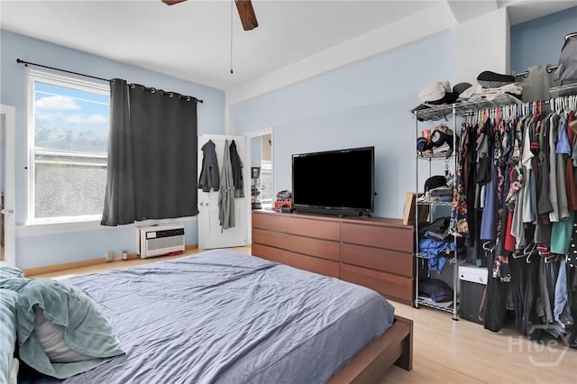 106 W Gwinnett St Unit 4D, Savannah, GA 31401 - bedroom with light wood-style flooring and a ceiling fan