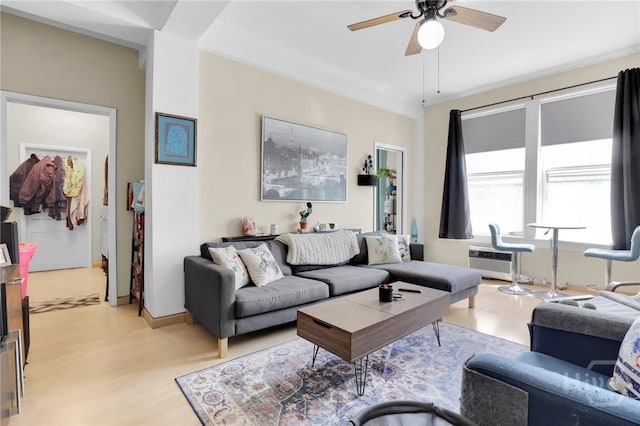 106 W Gwinnett St Unit 4D, Savannah, GA 31401 - living room featuring a ceiling fan, light wood-type flooring, and an AC wall unit