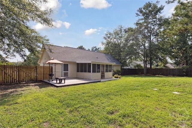 281 Barrister Cir, Guyton, GA 31312 - back of house with a gazebo, a sunroom, a fenced backyard, roof with shingles, and a deck