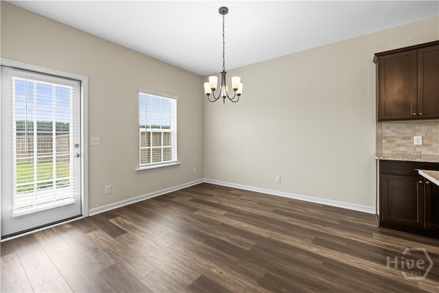 1161 Turpentine Trl, Hinesville, GA 31313 - unfurnished dining area with a chandelier and dark wood-type flooring