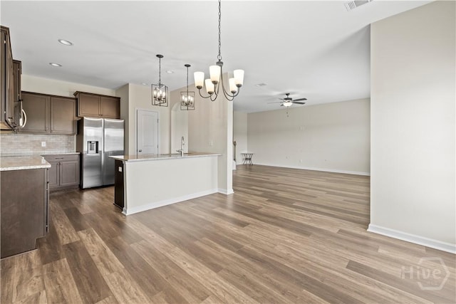 1161 Turpentine Trl, Hinesville, GA 31313 - kitchen featuring stainless steel refrigerator with ice dispenser, dark brown cabinets, a ceiling fan, a chandelier, and recessed lighting