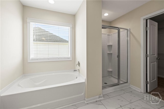 1161 Turpentine Trl, Hinesville, GA 31313 - bathroom featuring a garden tub, a stall shower, marble look tiles, and recessed lighting