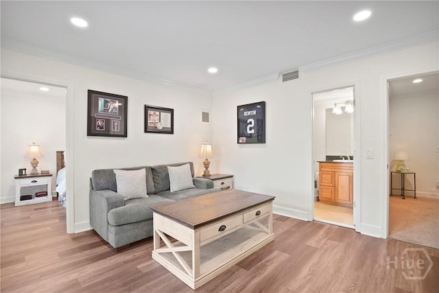 700 Wilmington Island Rd Unit T3, Savannah, GA 31410 - living room with crown molding, recessed lighting, and light wood-type flooring