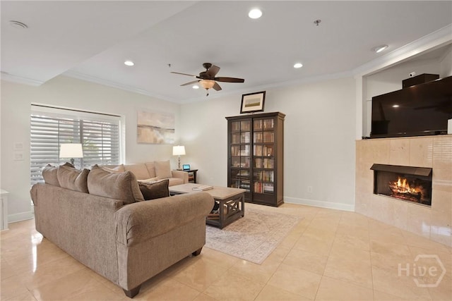 700 Wilmington Island Rd Unit T3, Savannah, GA 31410 - living area featuring a ceiling fan, light tile patterned flooring, a tiled fireplace, crown molding, and recessed lighting