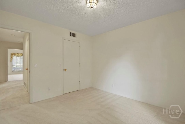 10804 Dorchester Rd, Savannah, GA 31406 - unfurnished bedroom with light carpet and a textured ceiling