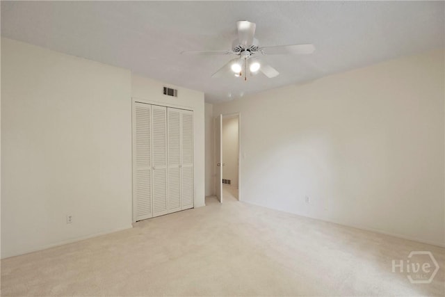 10804 Dorchester Rd, Savannah, GA 31406 - unfurnished bedroom with carpet floors, a closet, and a ceiling fan