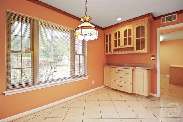 10804 Dorchester Rd, Savannah, GA 31406 - unfurnished dining area with light tile patterned floors and crown molding