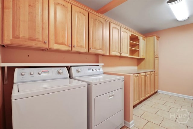 10804 Dorchester Rd, Savannah, GA 31406 - washroom with washer and dryer, cabinet space, and light tile patterned floors