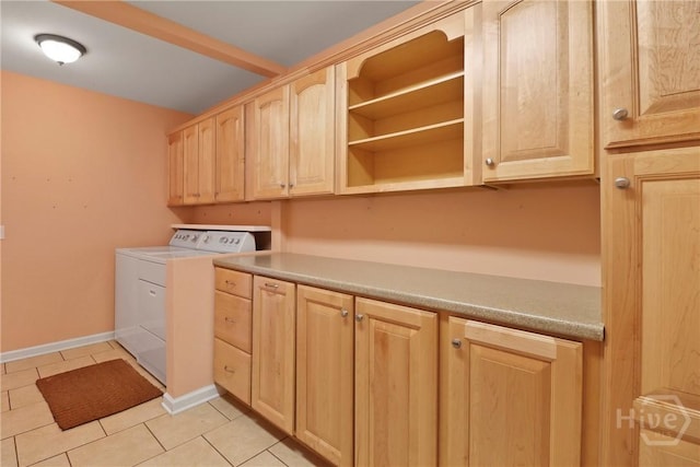 10804 Dorchester Rd, Savannah, GA 31406 - laundry room featuring cabinet space, washer and dryer, and light tile patterned floors