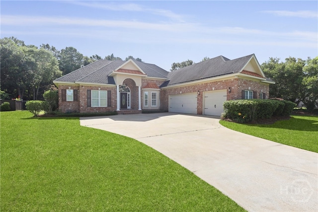 72 Roswell Trl, Richmond Hill, GA 31324 - view of front facade with an attached garage, a front lawn, concrete driveway, and brick siding
