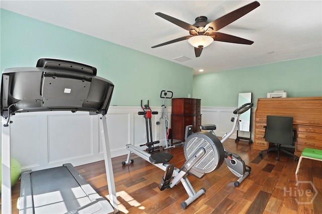 72 Roswell Trl, Richmond Hill, GA 31324 - workout room featuring wood finished floors, a ceiling fan, a wainscoted wall, and a decorative wall