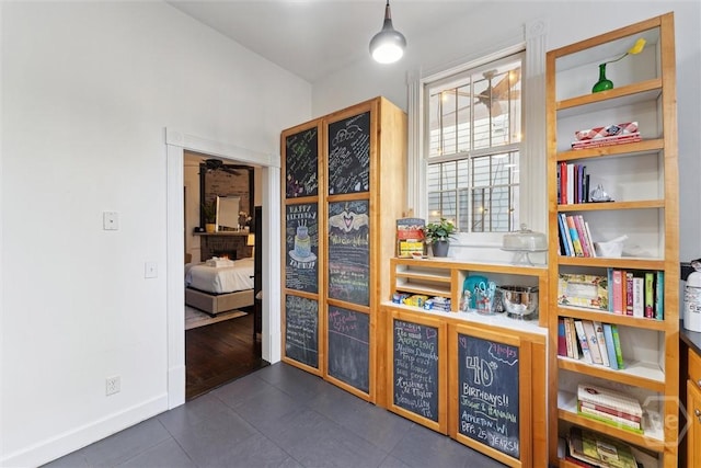 531 E Broad St, Savannah, GA 31401 - interior space with dark tile patterned flooring and baseboards
