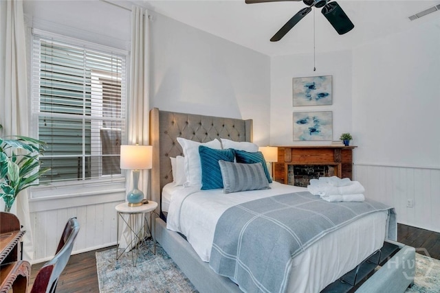 531 E Broad St, Savannah, GA 31401 - bedroom featuring wood finished floors, wainscoting, and a ceiling fan