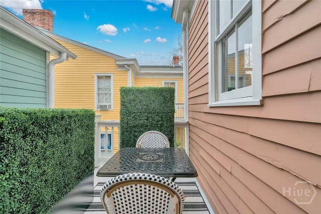 531 E Broad St, Savannah, GA 31401 - balcony with cooling unit and outdoor dining space