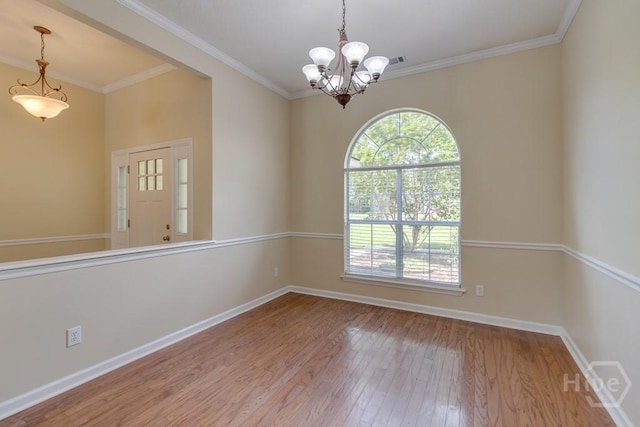 633 Greenwich Dr, Richmond Hill, GA 31324 - empty room with hardwood / wood-style flooring, a chandelier, and crown molding
