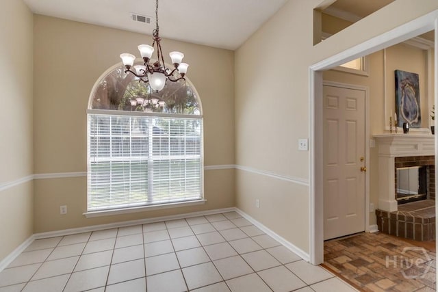 633 Greenwich Dr, Richmond Hill, GA 31324 - unfurnished dining area featuring a chandelier and a brick fireplace