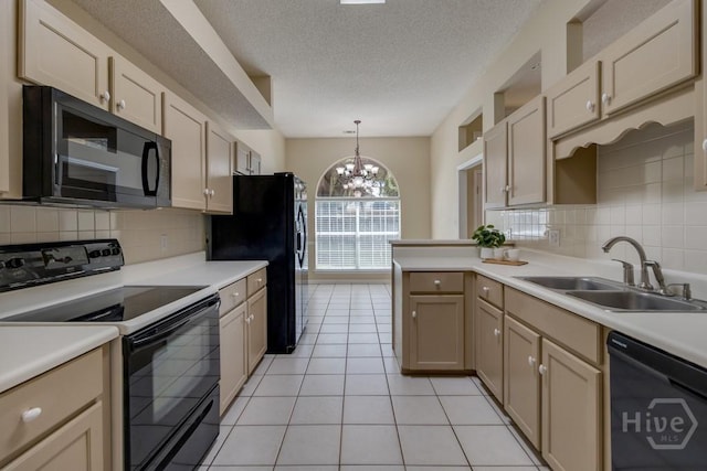 633 Greenwich Dr, Richmond Hill, GA 31324 - kitchen featuring black appliances, decorative backsplash, a chandelier, light countertops, and a textured ceiling