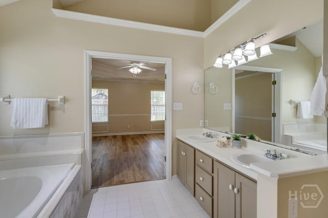 633 Greenwich Dr, Richmond Hill, GA 31324 - full bath featuring ornamental molding, a bath, double vanity, tile patterned flooring, and ceiling fan