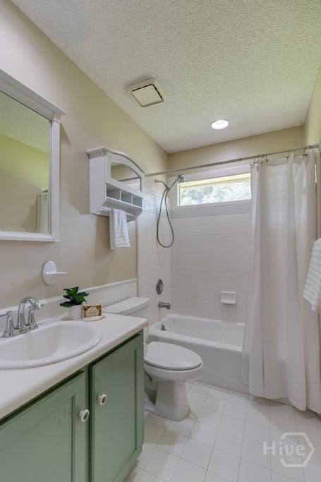 633 Greenwich Dr, Richmond Hill, GA 31324 - full bathroom featuring vanity, shower / tub combo with curtain, a textured ceiling, and tile patterned floors