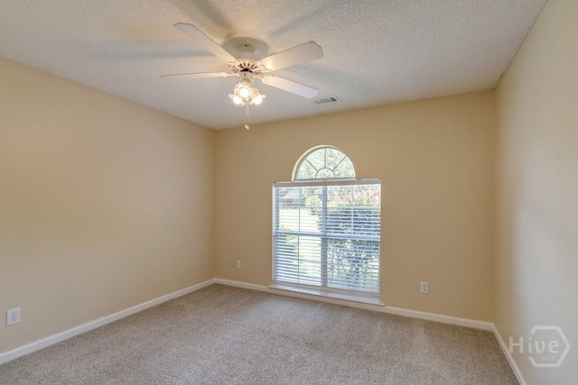 633 Greenwich Dr, Richmond Hill, GA 31324 - spare room with carpet flooring, a textured ceiling, and a ceiling fan