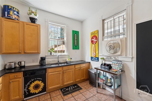 529 E Broad St, Savannah, GA 31401 - kitchen with black dishwasher, dark countertops, and light tile patterned floors