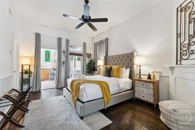 529 E Broad St, Savannah, GA 31401 - bedroom featuring access to outside, wood finished floors, a ceiling fan, and a wainscoted wall