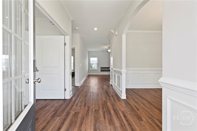 131 Guana Ln, Bloomingdale, GA 31302 - entryway with crown molding, arched walkways, dark wood-type flooring, ceiling fan, and recessed lighting