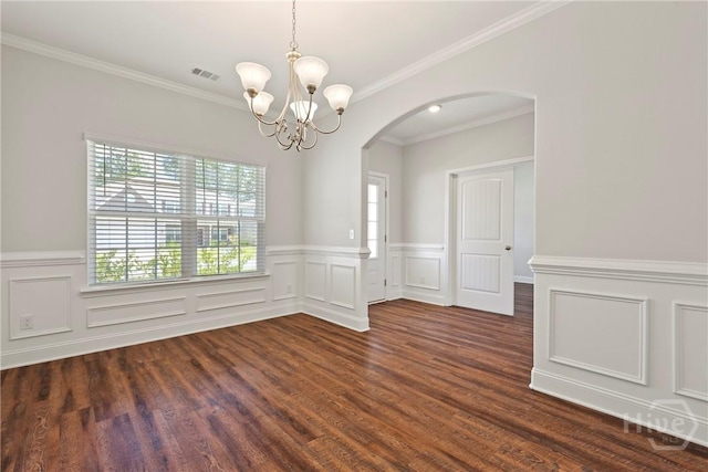 131 Guana Ln, Bloomingdale, GA 31302 - unfurnished room with arched walkways, a chandelier, wainscoting, crown molding, and dark wood-style floors