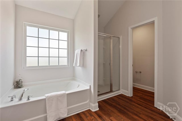 131 Guana Ln, Bloomingdale, GA 31302 - bathroom featuring a garden tub, a stall shower, and wood finished floors