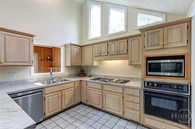 1333 La Vista Cir, Pooler, GA 31322 - kitchen with black appliances, light brown cabinetry, light countertops, and high vaulted ceiling
