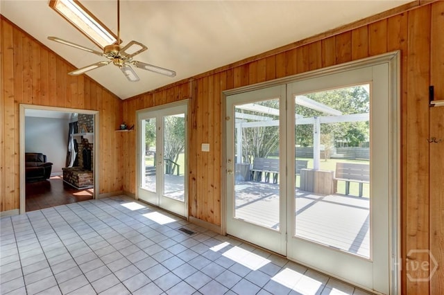 1333 La Vista Cir, Pooler, GA 31322 - doorway to outside with vaulted ceiling, wooden walls, ceiling fan, and tile patterned flooring