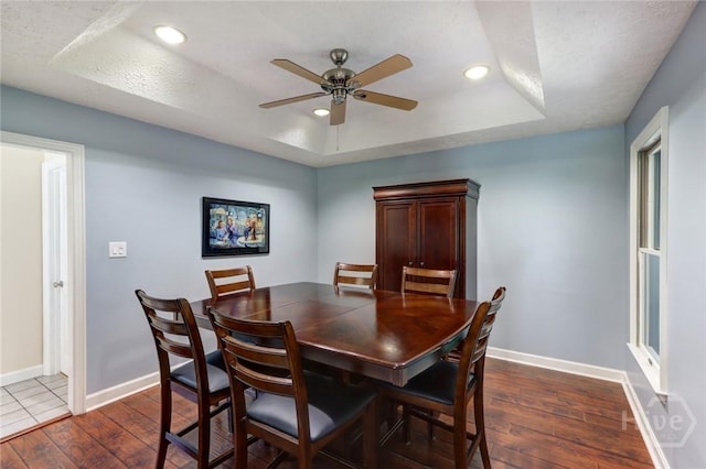 1333 La Vista Cir, Pooler, GA 31322 - dining room with dark wood-type flooring, a ceiling fan, a tray ceiling, and recessed lighting