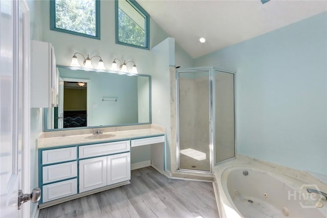 1333 La Vista Cir, Pooler, GA 31322 - full bath featuring a stall shower, vanity, a whirlpool tub, wood finished floors, and high vaulted ceiling