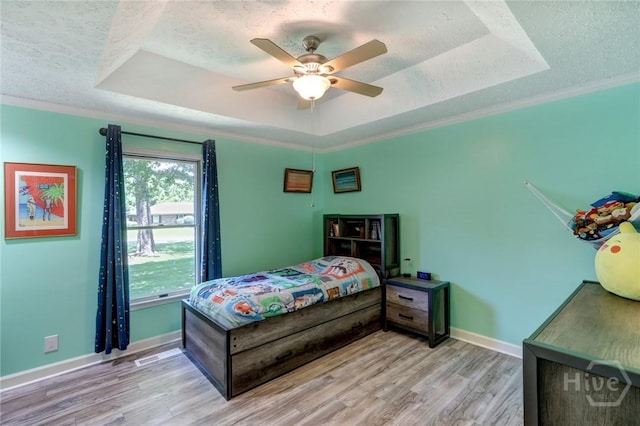 1333 La Vista Cir, Pooler, GA 31322 - bedroom with a raised ceiling, a textured ceiling, wood finished floors, a ceiling fan, and ornamental molding