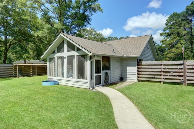 1333 La Vista Cir, Pooler, GA 31322 - back of house with a sunroom, roof with shingles, and a fenced backyard