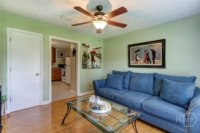 1333 La Vista Cir, Pooler, GA 31322 - living area with light wood-style flooring, ceiling fan, and a textured ceiling