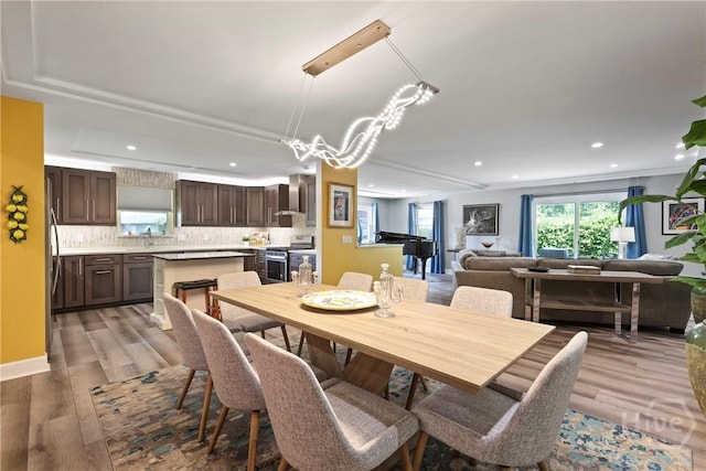 7619 Lynes Ct, Savannah, GA 31406 - dining area with wood finished floors and recessed lighting