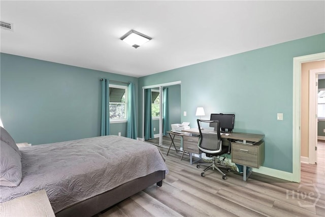 7619 Lynes Ct, Savannah, GA 31406 - bedroom featuring wood finished floors, a closet, and a desk