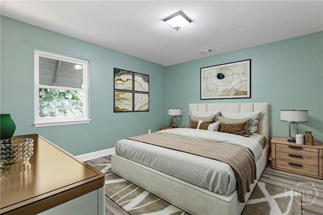 7619 Lynes Ct, Savannah, GA 31406 - bedroom with baseboards and light wood-type flooring