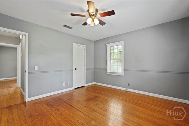 265 Mahan St, Jesup, GA 31545 - unfurnished bedroom featuring wood finished floors and ceiling fan