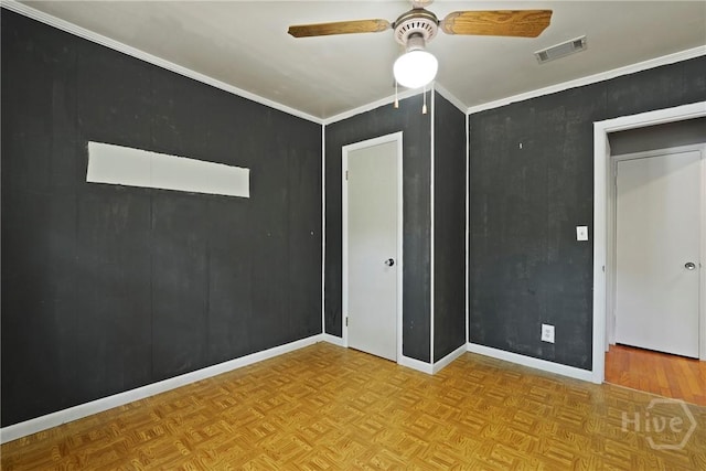 265 Mahan St, Jesup, GA 31545 - unfurnished bedroom featuring a ceiling fan and parquet flooring