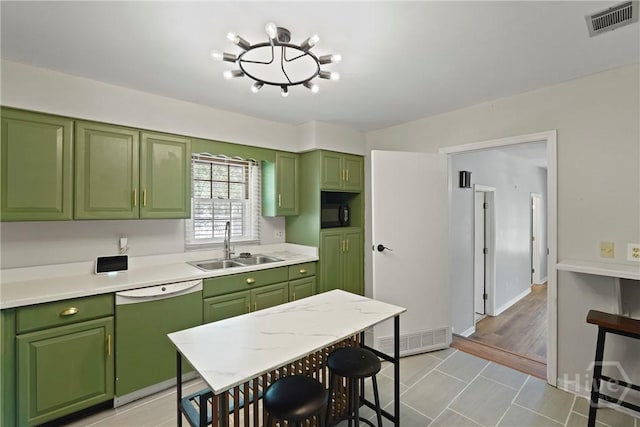 265 Mahan St, Jesup, GA 31545 - kitchen with dishwasher, green cabinets, and light countertops