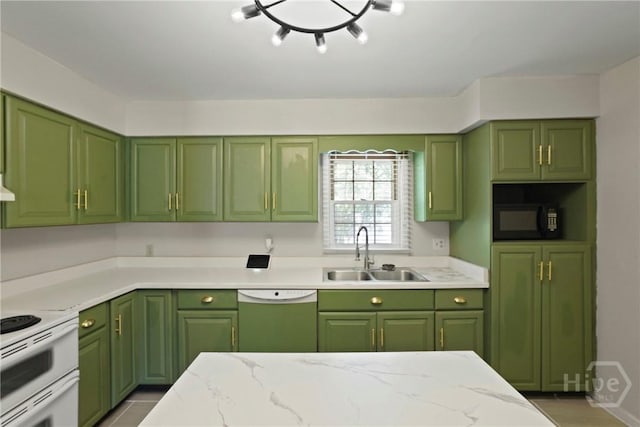 265 Mahan St, Jesup, GA 31545 - kitchen with white appliances, green cabinetry, and light stone countertops