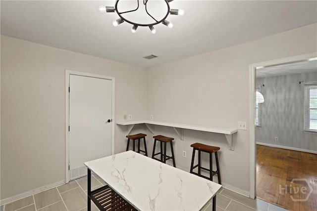 265 Mahan St, Jesup, GA 31545 - dining room with a chandelier and tile patterned flooring