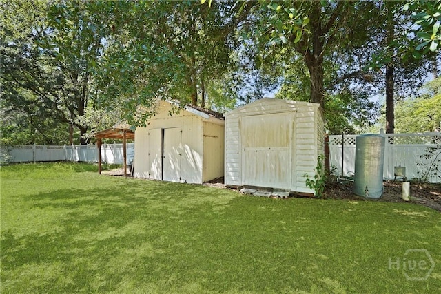 265 Mahan St, Jesup, GA 31545 - view of shed featuring a fenced backyard