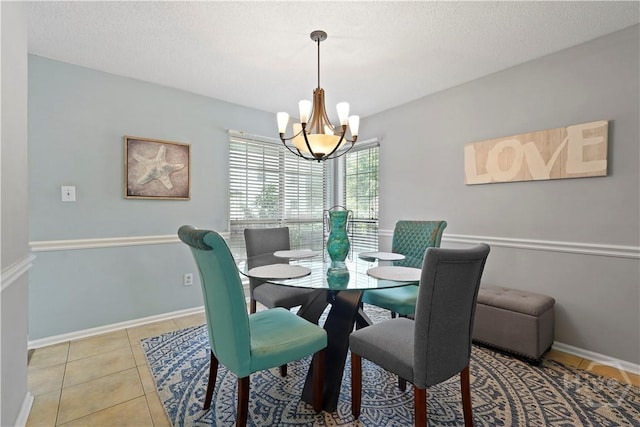 505 Pointe N Dr, Savannah, GA 31410 - dining space with a chandelier, light tile patterned floors, and a textured ceiling